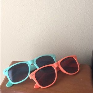 2 sunglasses, coral and teal colored.